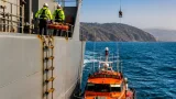 Crewman with crushed leg airlifted after daring RNLI ladder rescue off Anglesey